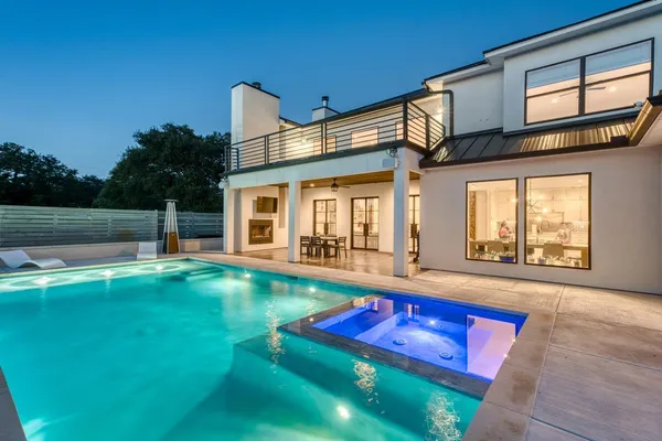 a view of an house with a swimming pool