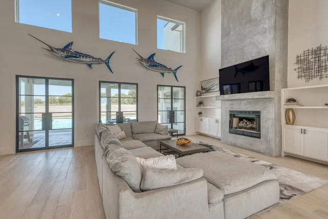 a living room with furniture fireplace and flat screen tv