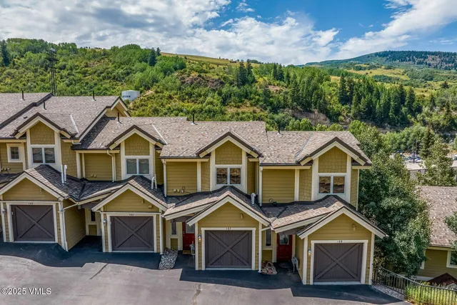 a view of a balcony with wooden fence