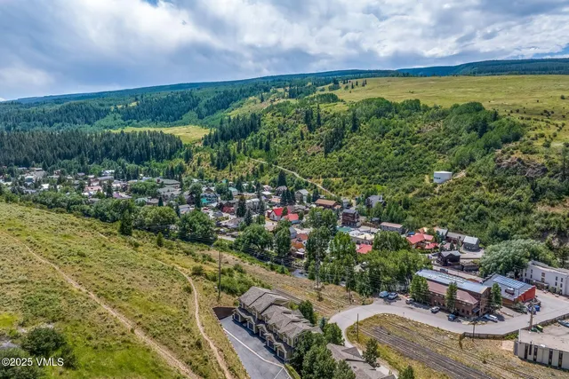 a balcony with a table and chairs