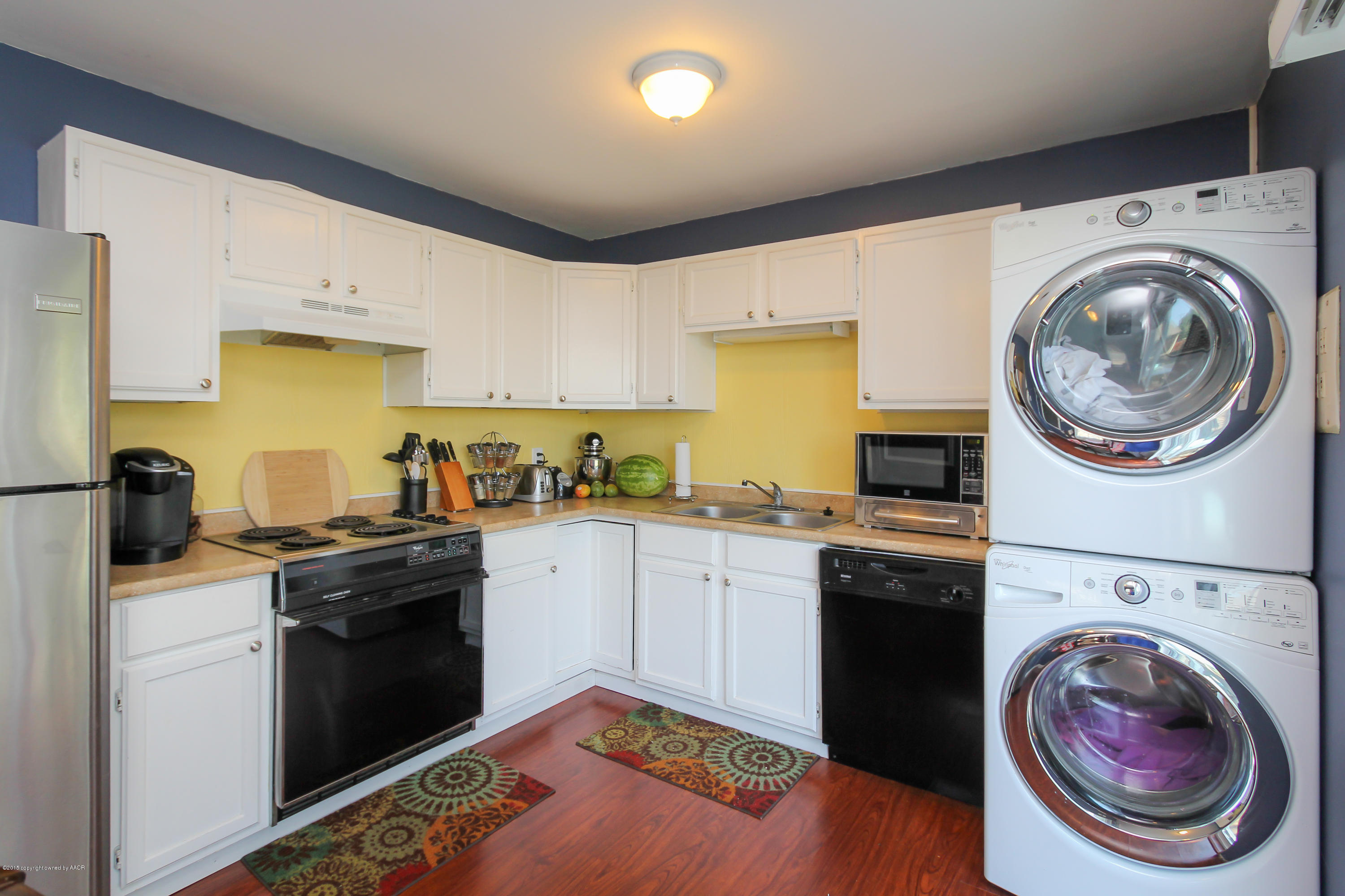 4308 South Monroe Street Amarillo, TX 79110 - Photo 8 of 18 a kitchen with a stove top oven sink and cabinets