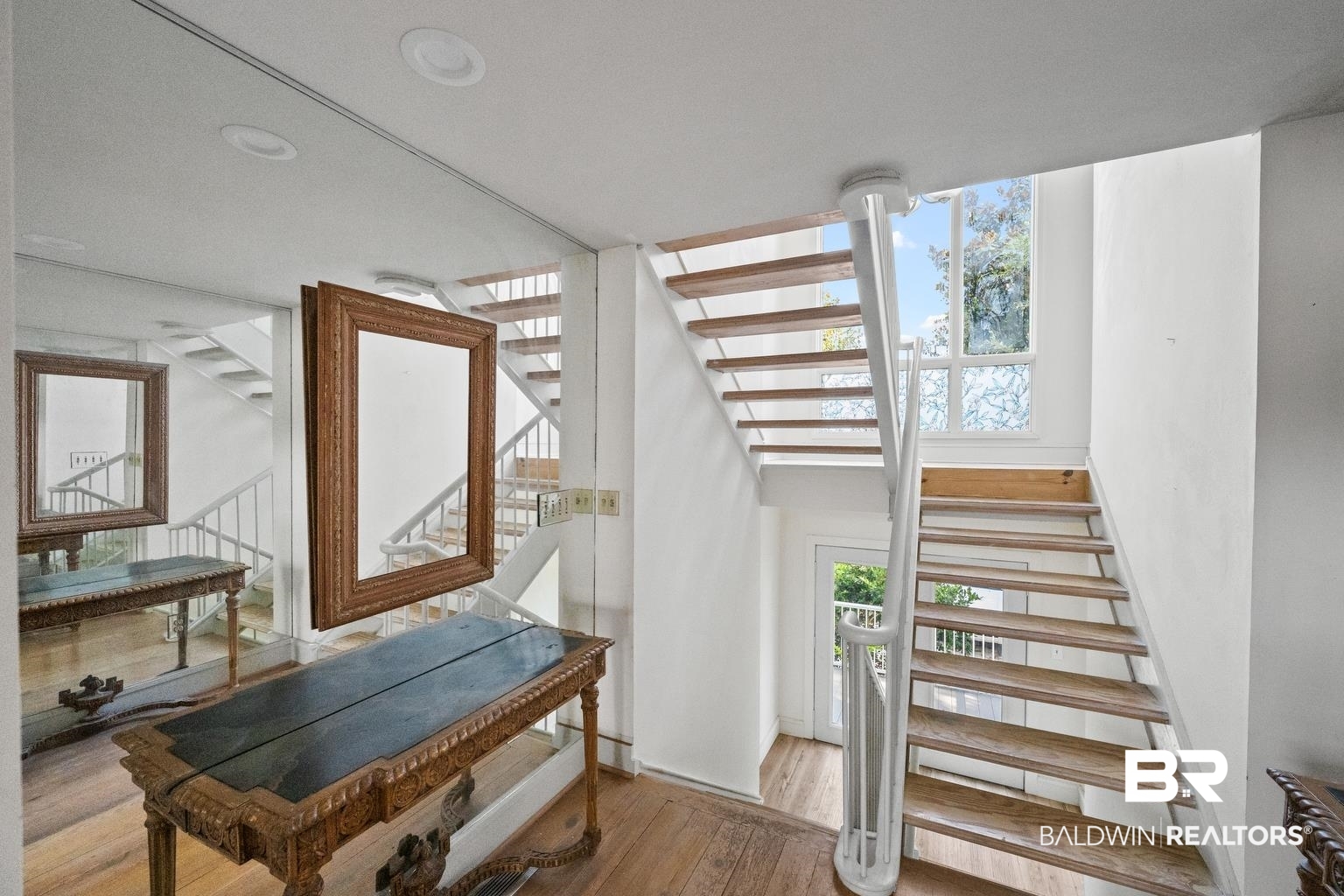 29255 Ono Boulevard Orange Beach, AL 36561 - Photo 16 of 43 Stairway featuring wood finished floors