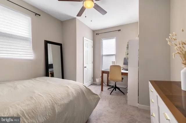 a bedroom with a bed and a dresser