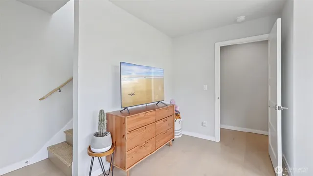 a room with bed and mirror