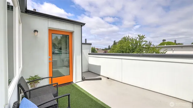 a view of a patio with couches table and chairs and potted plants