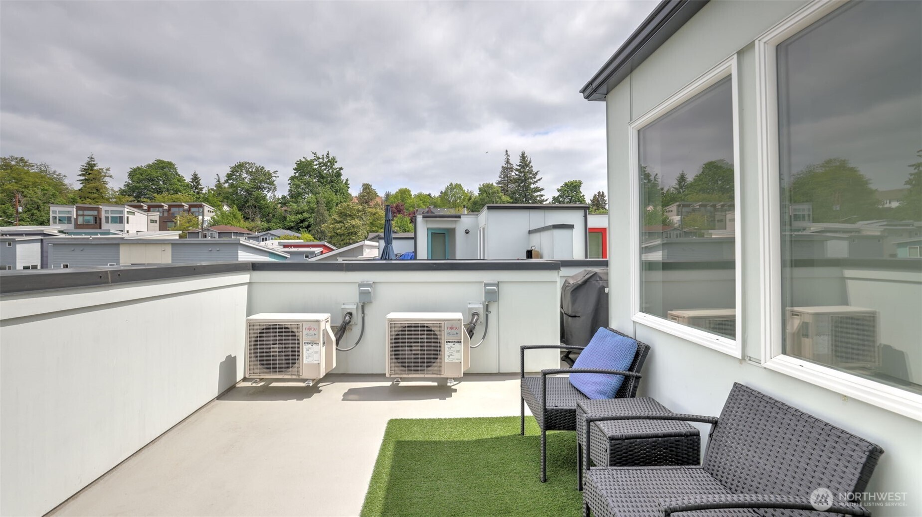 3638 36th Avenue South, Unit B Seattle, WA 98144 - Photo 18 of 19 a view of a patio with couches table and chairs and potted plants