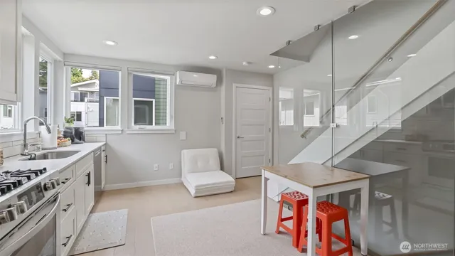 a living room with furniture and a stove