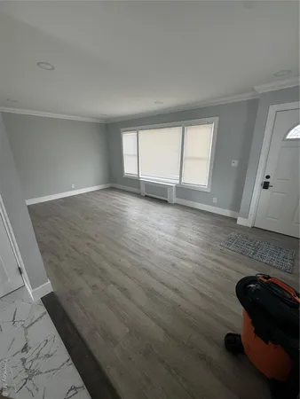 a view of wooden floor and staircase in a room