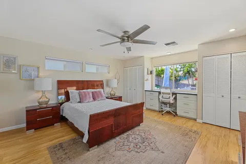 a bedroom with a bed and a couch