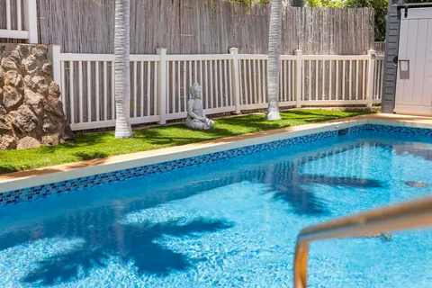 a view of swimming pool with a yard