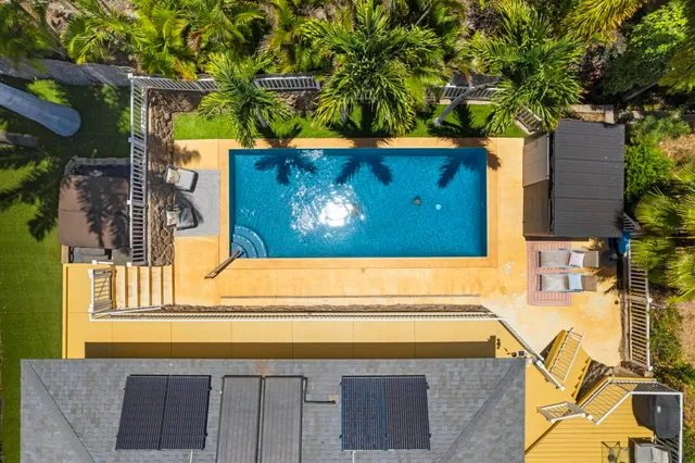 an aerial view of a house with a garden