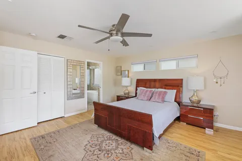 a bedroom with a bed and a dresser