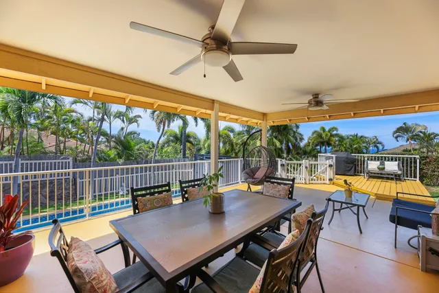 a view of a patio with a table chairs and a table
