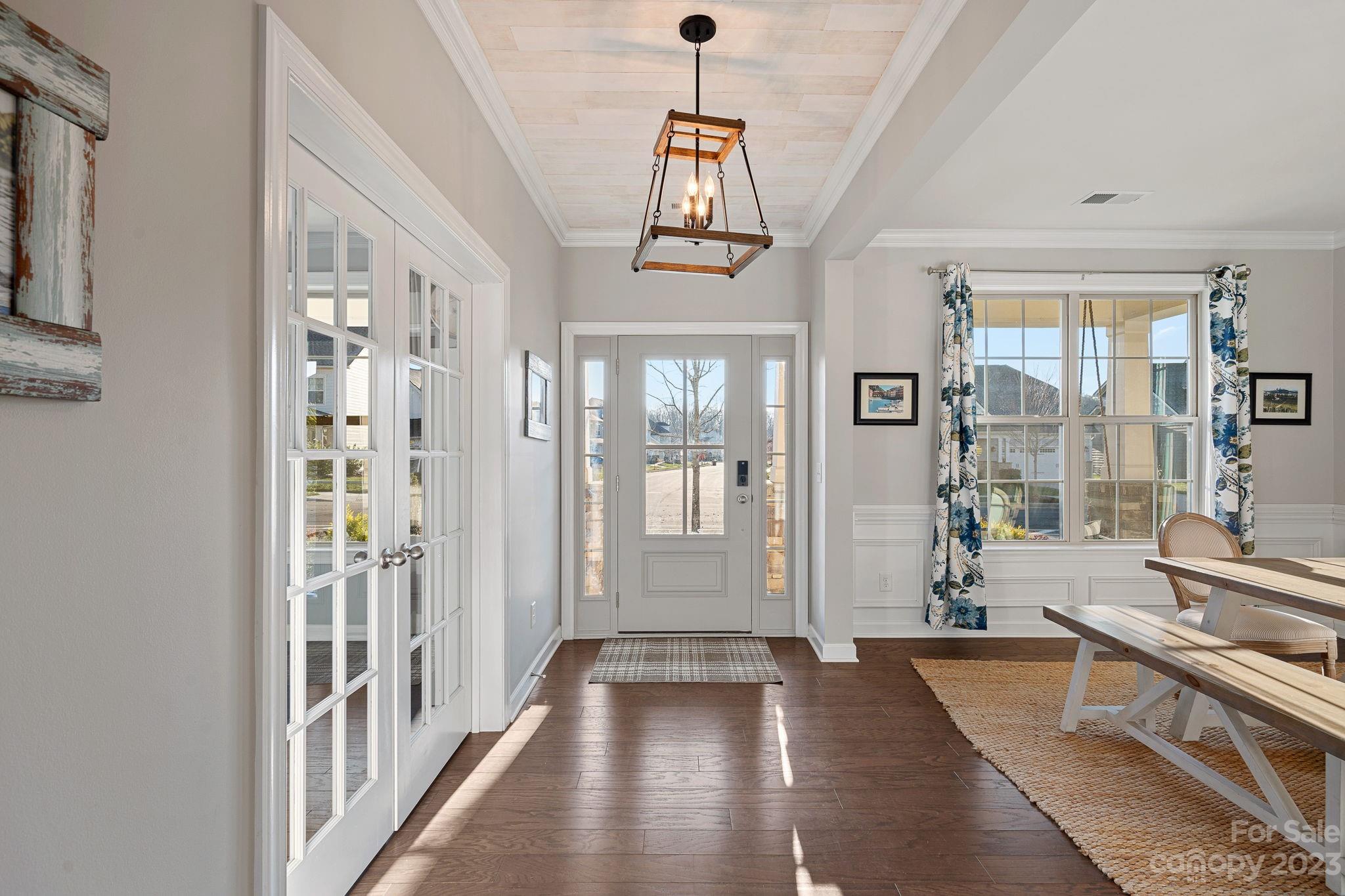 17423 Shearer Road Davidson, NC 28036 - Photo 3 of 48 a view of a hallway with wooden floor and a living room