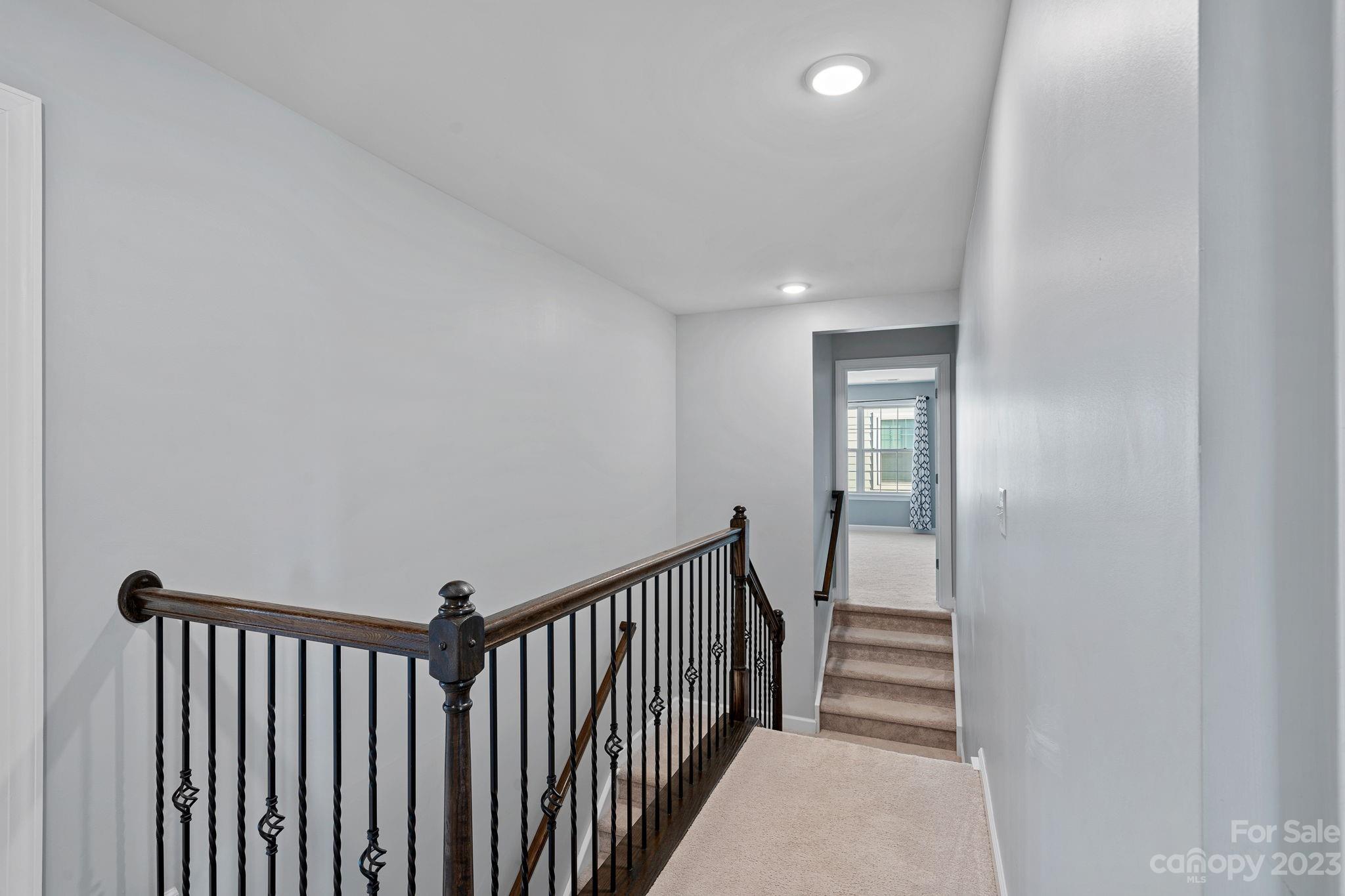 17423 Shearer Road Davidson, NC 28036 - Photo 34 of 48 a view of a hallway with wooden floor and staircase