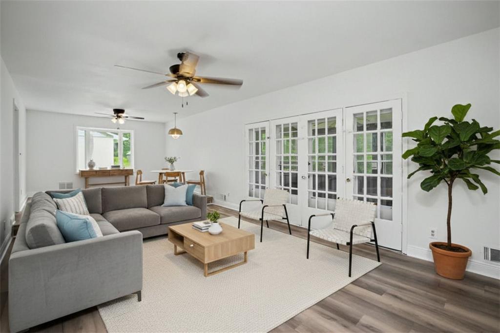 1605 Shackelford Road Griffin, GA 30224 - Photo 6 of 51 a living room with furniture and a potted plant
