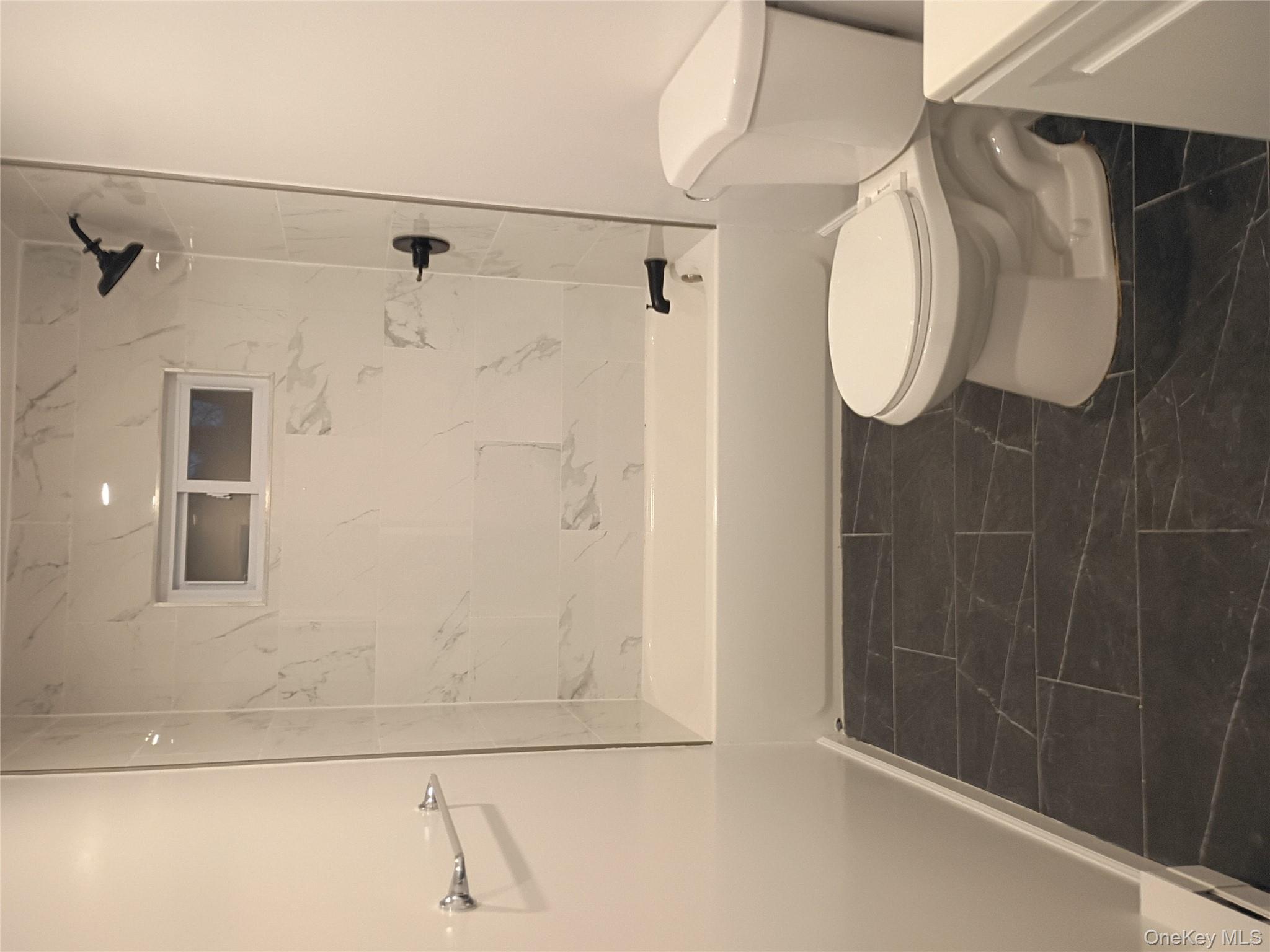 67 Albany Avenue, Unit A&B Flanders, NY 11901 - Photo 18 of 24 Full bathroom featuring washtub / shower combination and vanity