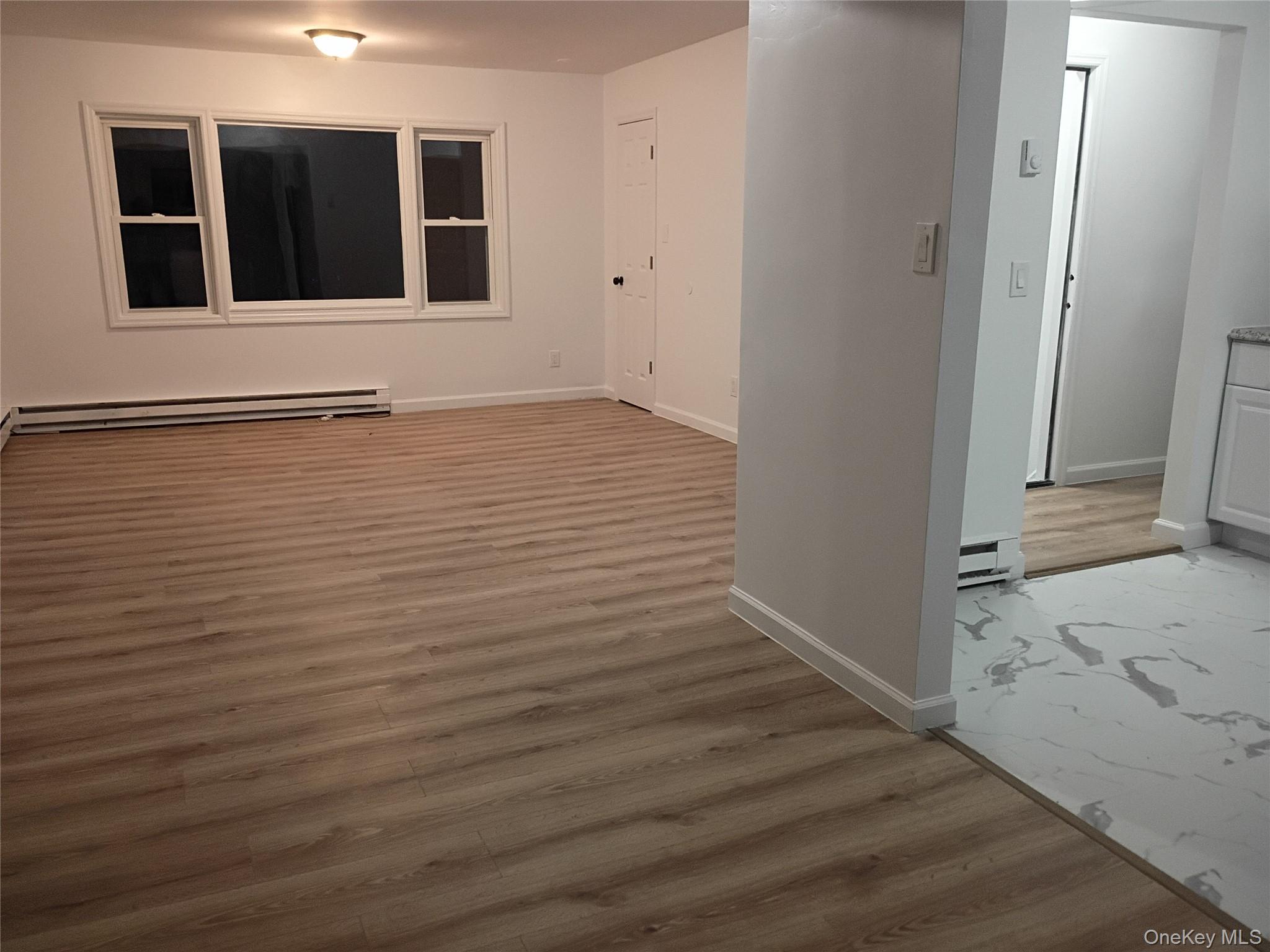 67 Albany Avenue, Unit A&B Flanders, NY 11901 - Photo 2 of 24 Large living room with view of formal dining room and kitchen