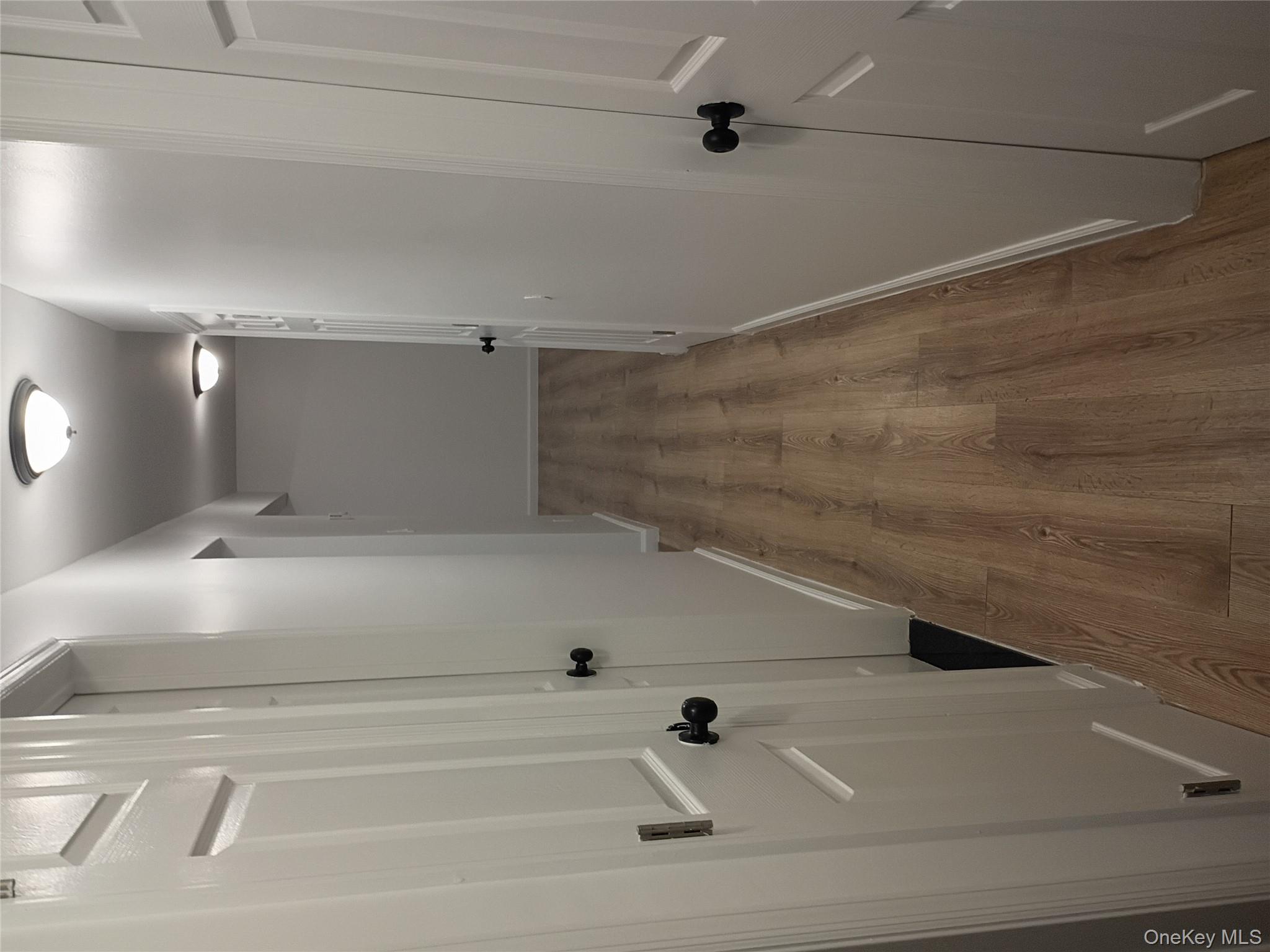 67 Albany Avenue, Unit A&B Flanders, NY 11901 - Photo 7 of 24 Corridor with wood finished floors and baseboards