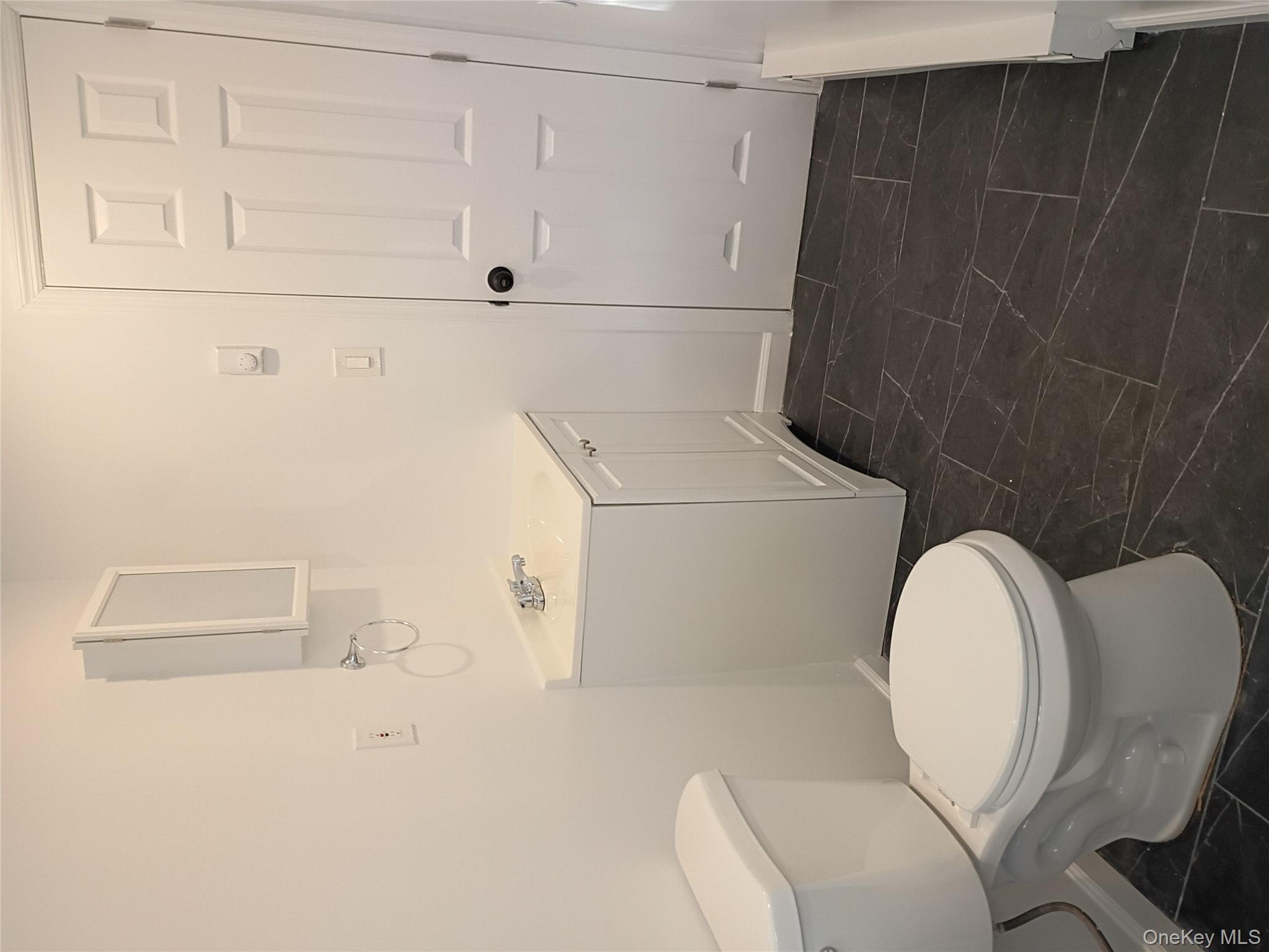 67 Albany Avenue, Unit A&B Flanders, NY 11901 - Photo 8 of 24 Half bathroom with vanity and baseboards