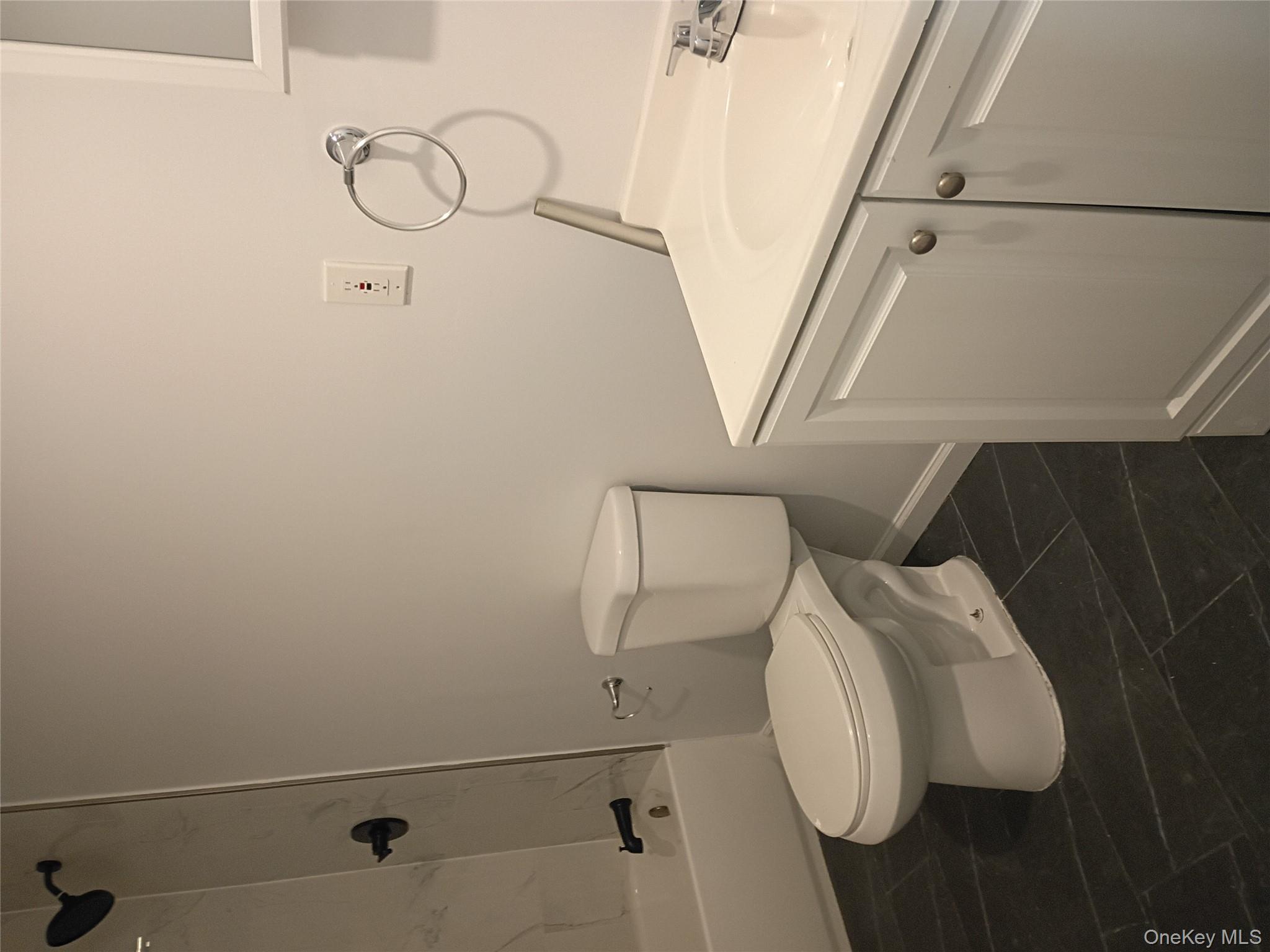 67 Albany Avenue, Unit A&B Flanders, NY 11901 - Photo 9 of 24 Full bath featuring vanity and tub / shower combination