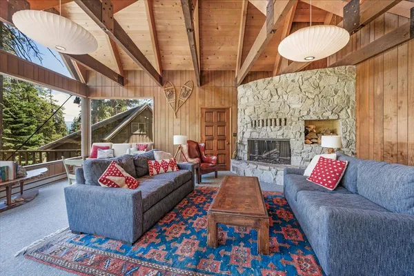a dining room with furniture window and wooden floor