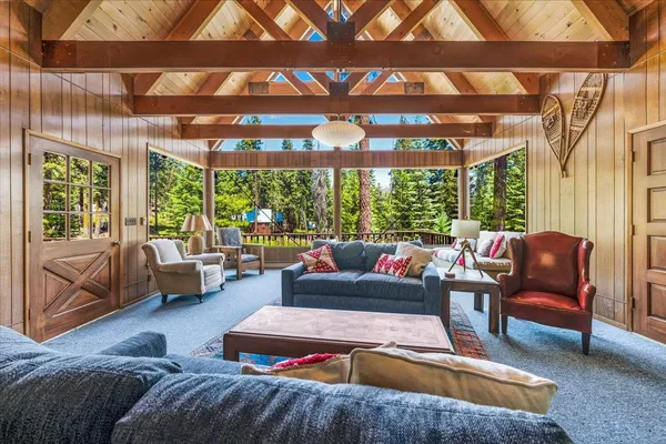 a view of a dining table and chairs in the balcony