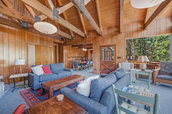 a view of a living room and kitchen with a large window