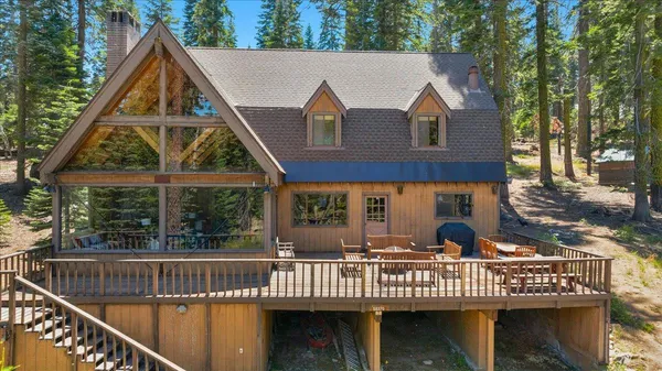 a front view of a house with a garden and deck