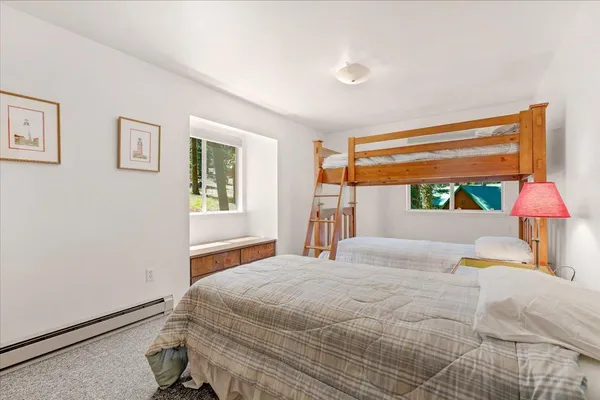a view of backyard with outdoor seating and wooden floor
