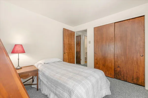 an aerial view of a house with swimming pool and porch