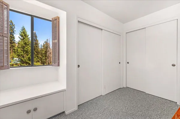 a view of a lush green hillside and a building