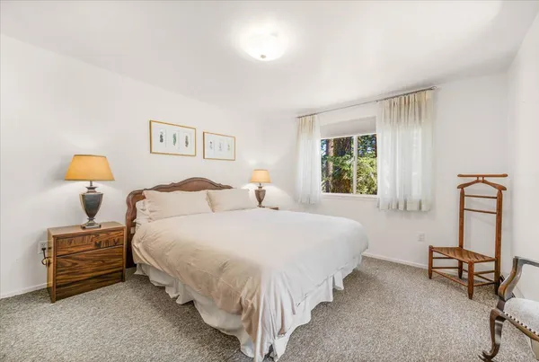 a view of a lake view with mountain in the background