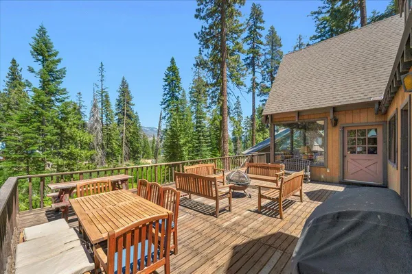 a outdoor living space with furniture and a rug