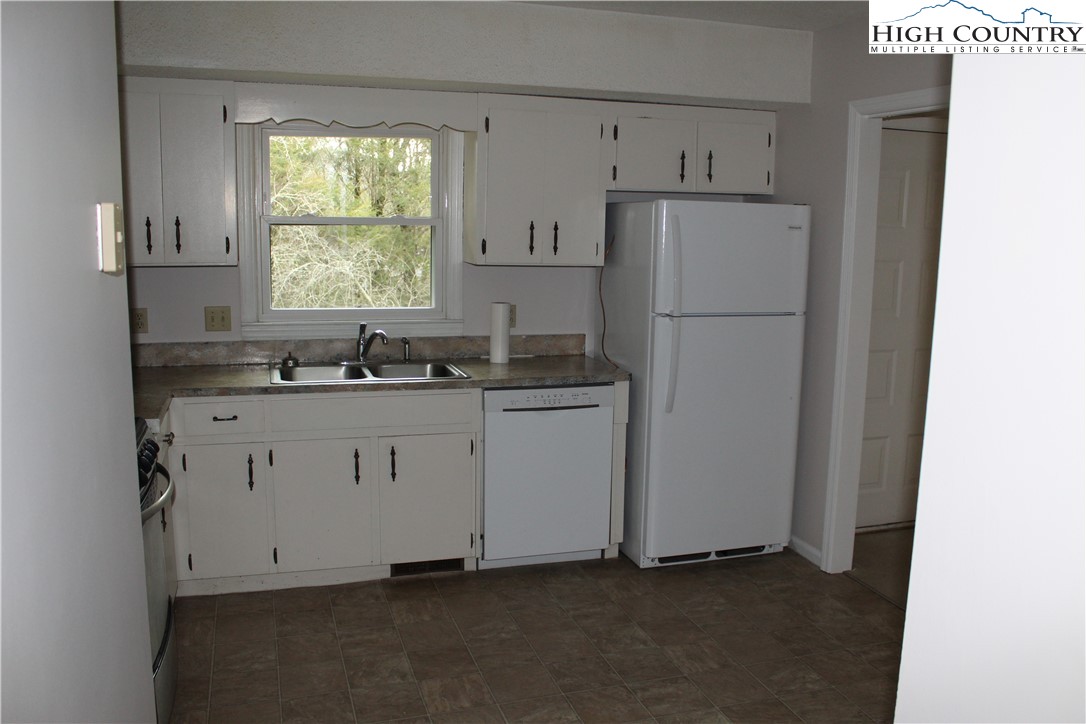 465 Highland Avenue Boone, NC 28607 - Photo 6 of 10 a kitchen with cabinets appliances and a window