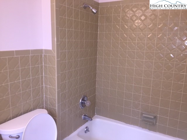 465 Highland Avenue Boone, NC 28607 - Photo 9 of 10 a bathroom with a sink and toilet