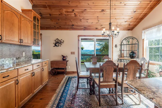 a open kitchen with dining table and chairs