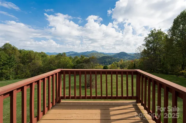 a balcony with wooden floor in city view