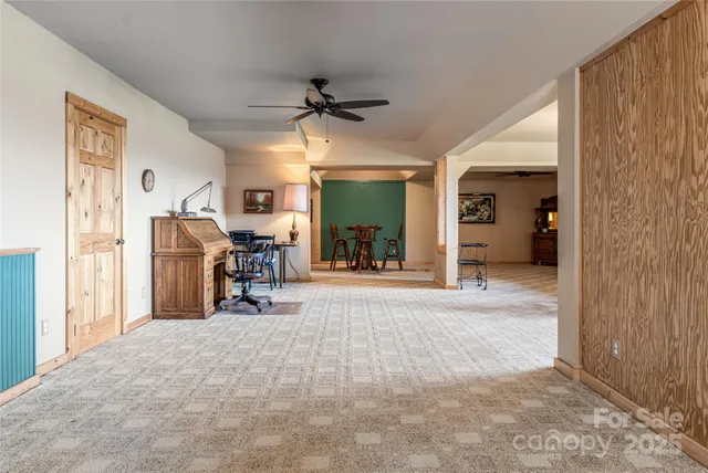 a view of a livingroom with furniture and a flat screen tv