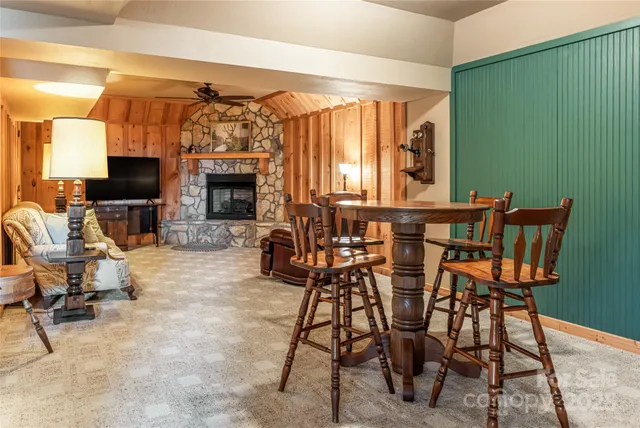 a view of a livingroom with furniture and a fireplace