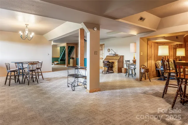 a view of a livingroom with furniture and a ceiling fan