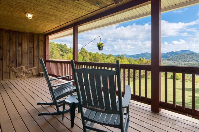 a view of a two chairs in the balcony