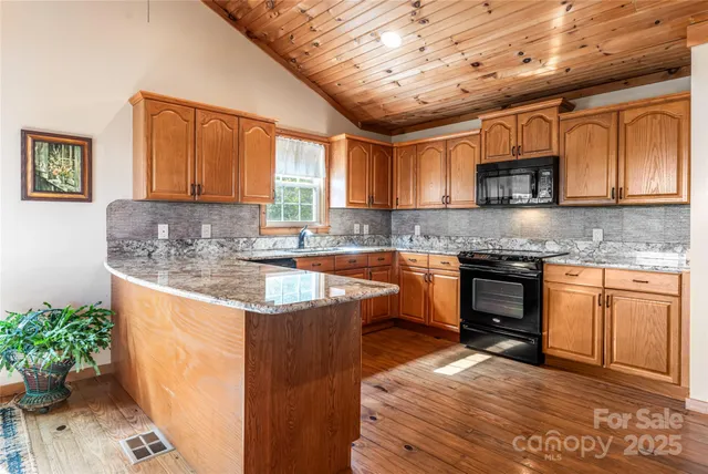 a kitchen with granite countertop lots of counter top space