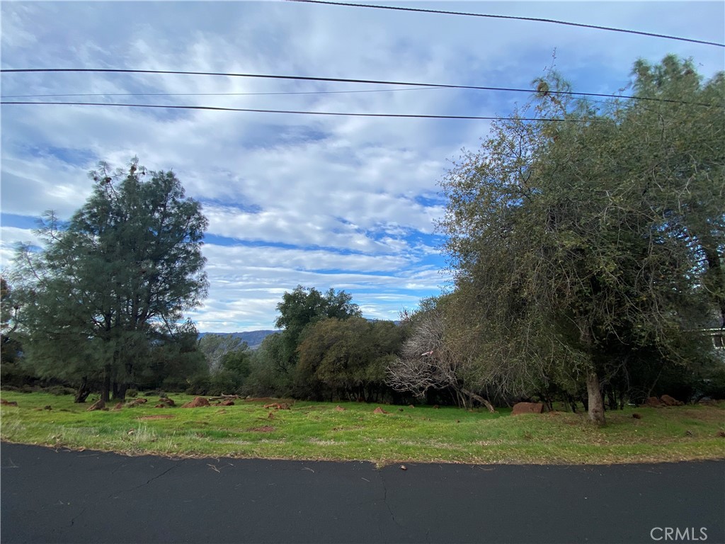 15749 Little Peak Road Hidden Valley Lake, CA 95467 - Photo 4 of 4 a view of a field and a building in the background