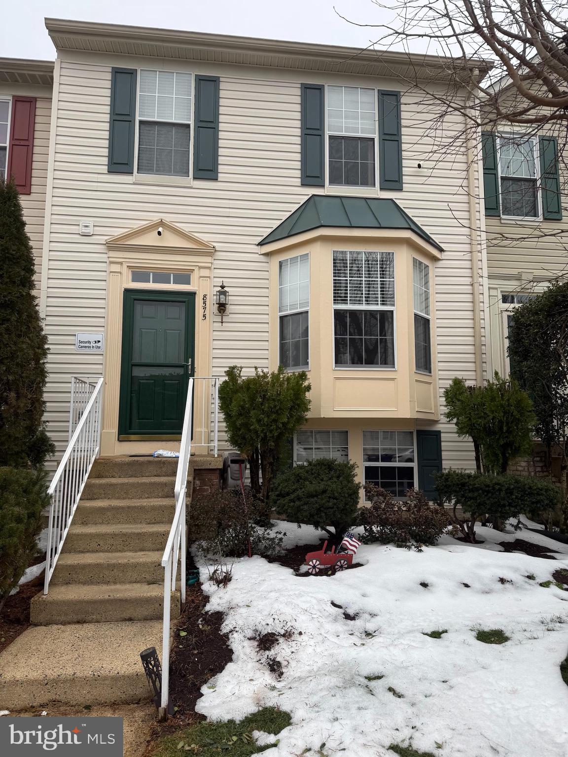8575 Cold Harbor Loop Manassas, VA 20111 - Photo 1 of 17 a front view of a house with a yard and garage