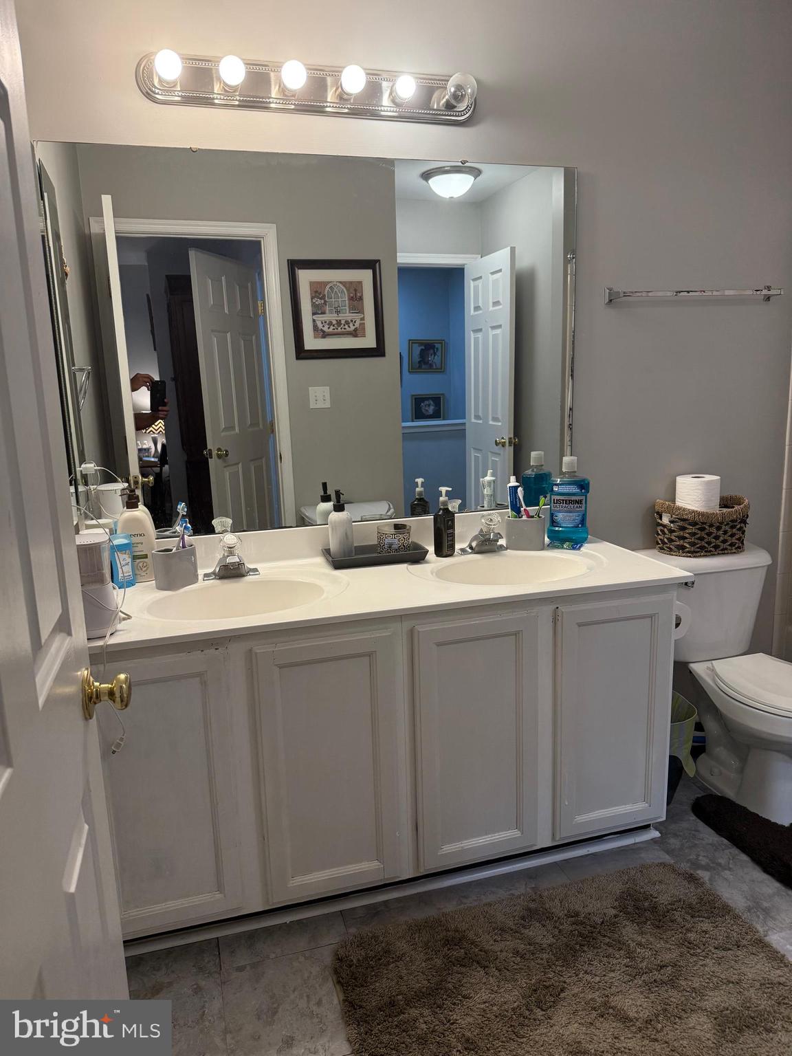 8575 Cold Harbor Loop Manassas, VA 20111 - Photo 12 of 17 a bathroom with a sink and a mirror