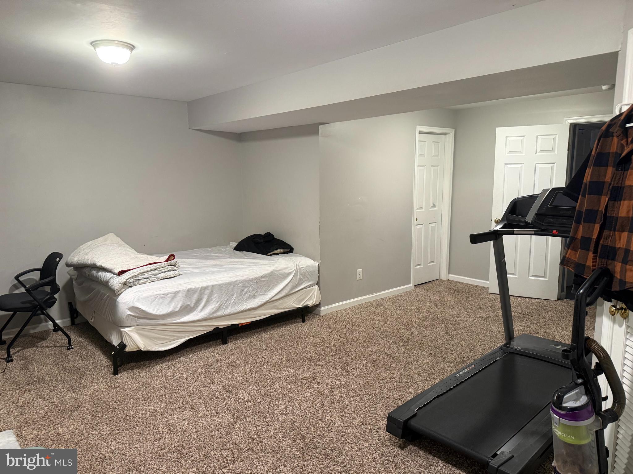 8575 Cold Harbor Loop Manassas, VA 20111 - Photo 15 of 17 a bedroom with a bed and wooden floor