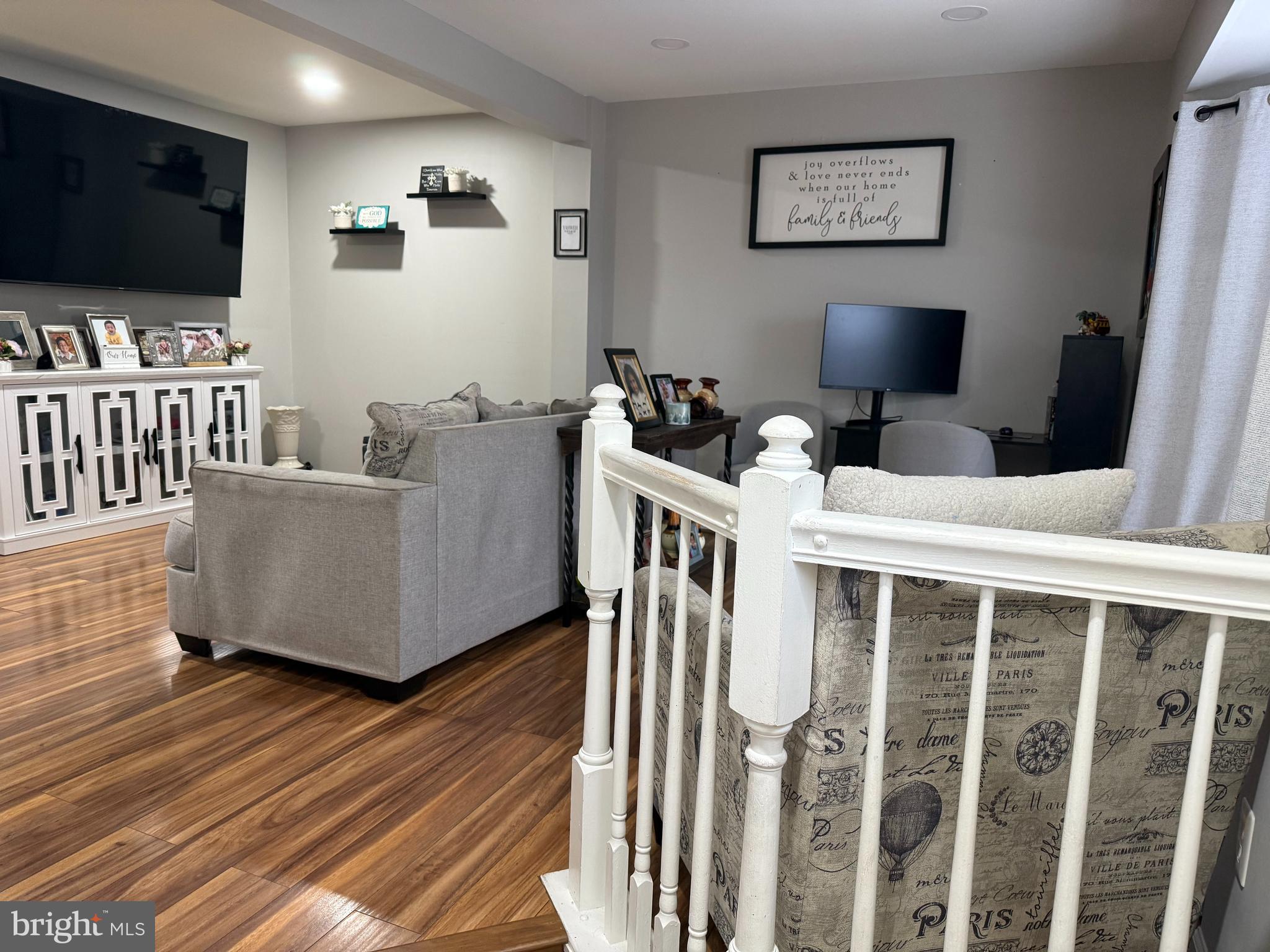 8575 Cold Harbor Loop Manassas, VA 20111 - Photo 2 of 17 a living room with furniture and a flat screen tv