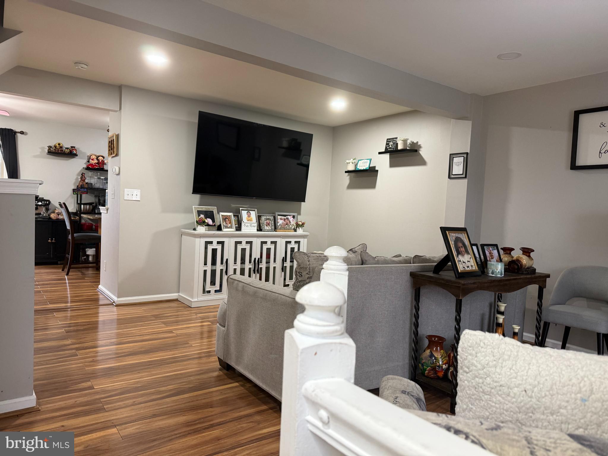 8575 Cold Harbor Loop Manassas, VA 20111 - Photo 3 of 17 a living room with furniture and a flat screen tv