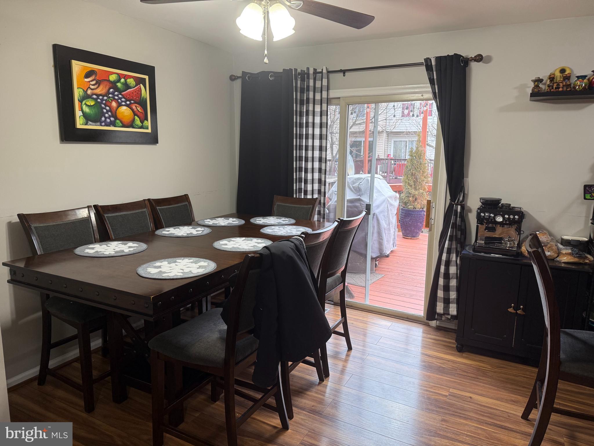 8575 Cold Harbor Loop Manassas, VA 20111 - Photo 5 of 17 a view of a dining room with furniture window and wooden floor